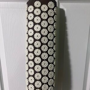 Brown and White Acupressure Mat